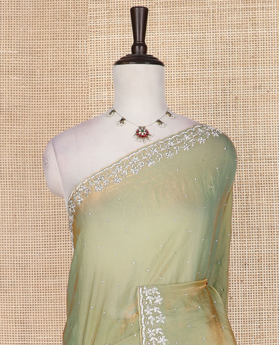 Green stone work designer saree, floral designs stone embroidered scallop border