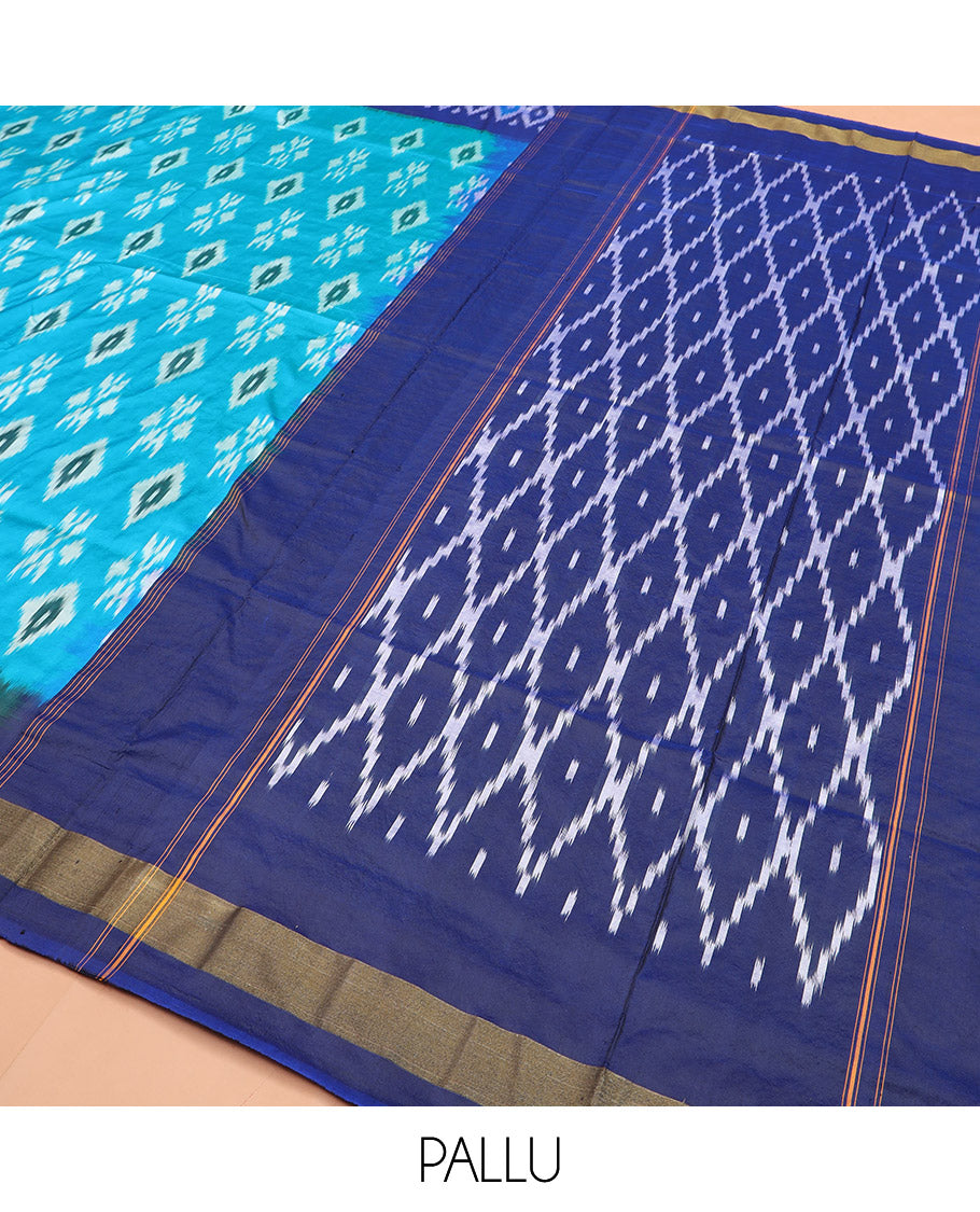 Blue Ikkat Silk Saree Decorated with Ikkat Buttas, Complemented by a Contrast Border, a Subtly Woven Pallu of Jaal Design, and a Contrast Plain Blouse