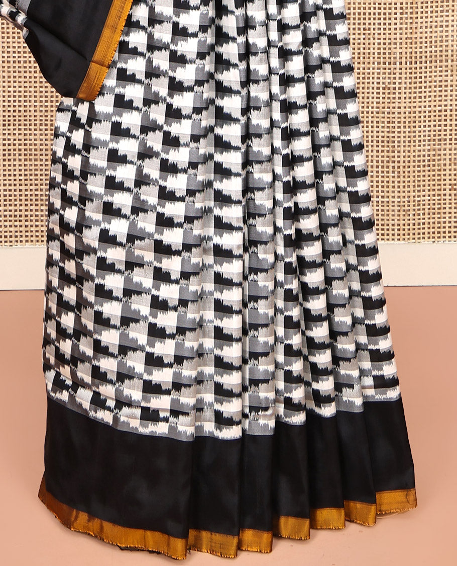 Black and White Pochampally Ikat Silk Saree, Spotlighted with Geometric Patterns on Its Body, Complemented by Contrast Border, Pallu of Diamond Patterns, and Paired with a Contrast Blouse