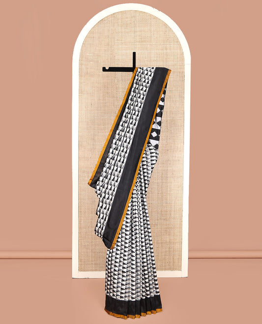 Black and White Pochampally Ikat Silk Saree, Spotlighted with Geometric Patterns on Its Body, Complemented by Contrast Border, Pallu of Diamond Patterns, and Paired with a Contrast Blouse