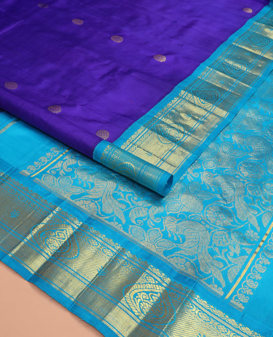 Blue zari buttas kanchipuram silk saree, contrast korvai border of zari designs, and pallu of floral and mayil designs