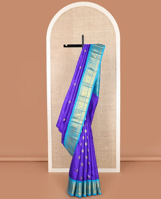 Blue zari buttas kanchipuram silk saree, contrast korvai border of zari designs, and pallu of floral and mayil designs