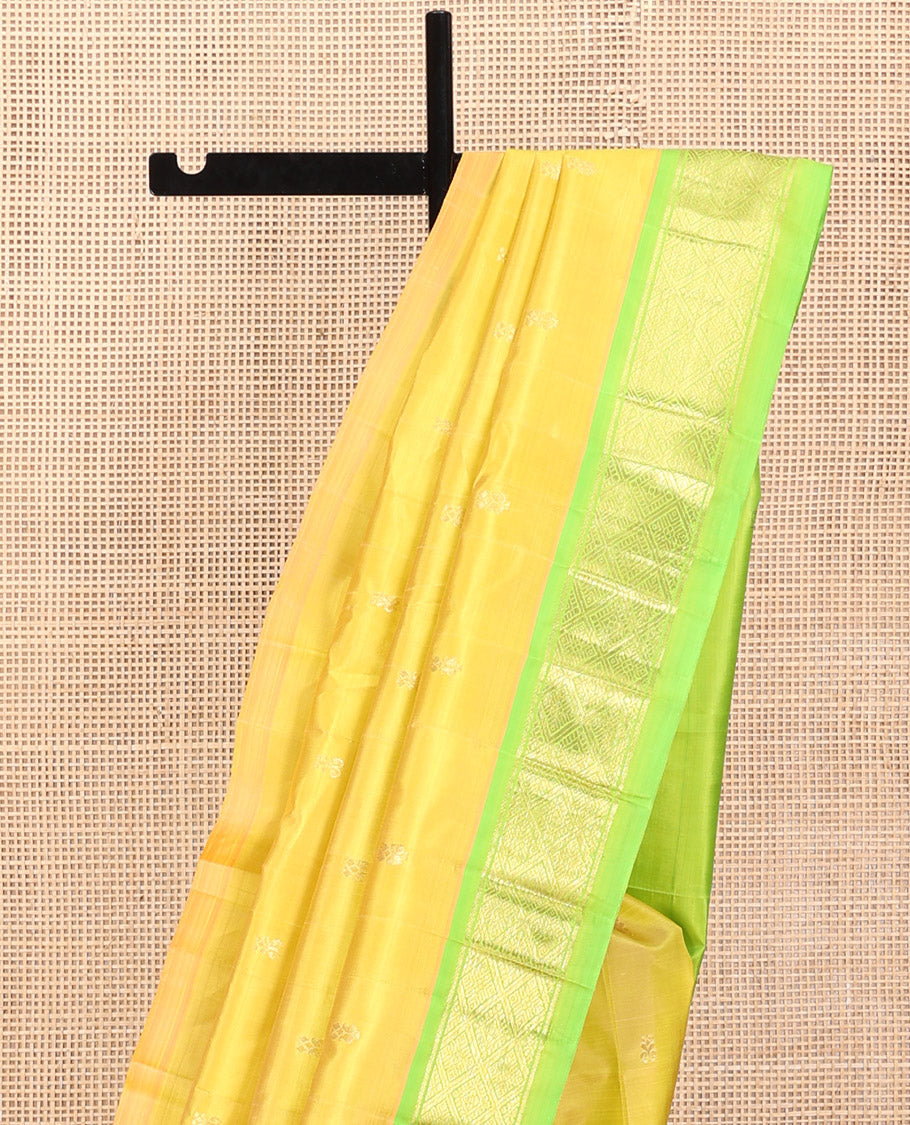 Green Kanchipuram Silk Saree, Graced with Zari Buttas, a Contrast One-Sided Jaal Design Zari Border, Zari-Woven Pallu, and No Blouse