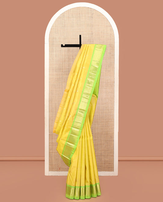 Green Kanchipuram Silk Saree, Graced with Zari Buttas, a Contrast One-Sided Jaal Design Zari Border, Zari-Woven Pallu, and No Blouse