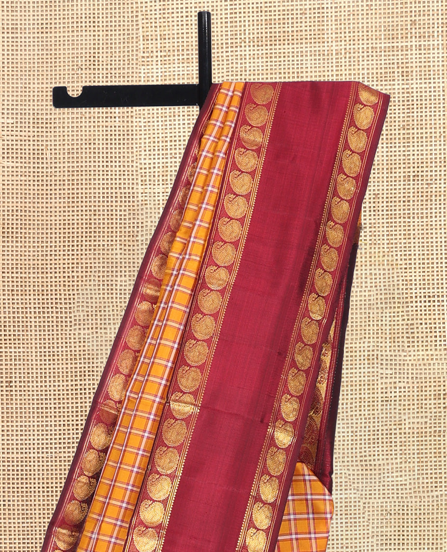 Orange Checked Kanchipuram Silk Saree, Complemented by a Contrast Rettai Pettu Manga Border, Zari Woven Pallu, and Contrast Blouse