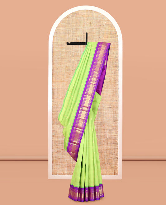 Green Kanchipuram Silk Saree, Delicately Woven with Zari Buttas, Complemented by a Contrast Korvai Border of Panner Sombu, Banaras, Muthu, and Mayil Kann Design, Pallu of Zari Design, and No Blouse