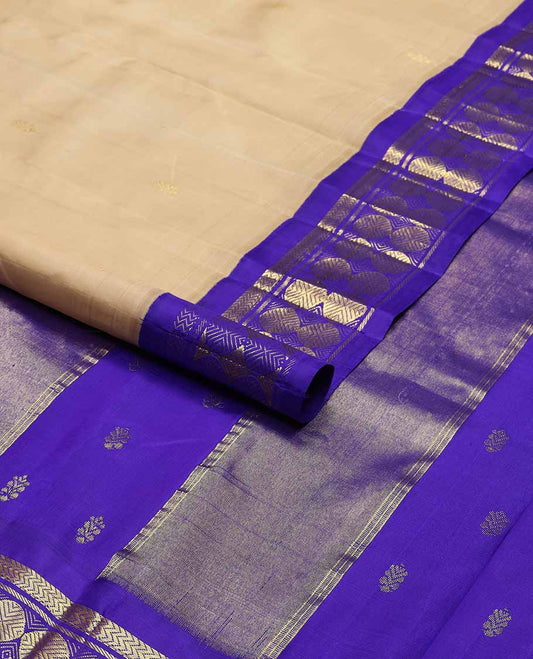 Beige buttas kancheepuram silk saree with contrast korvai border of vanki, banaras, paun design & zari design pallu