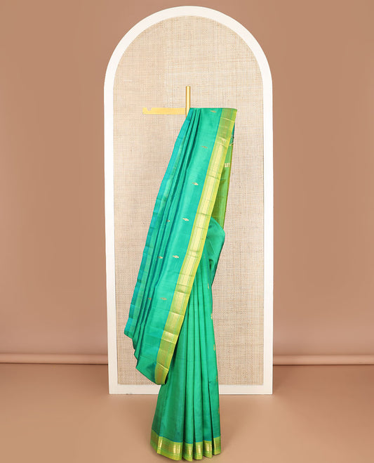 Green zari buttas Kanchipuram silk saree, contrast one-sided border of banaras, neli & jaal & zari design pallu