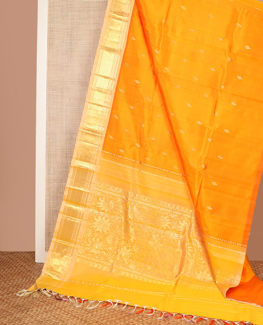 Orange zari buttas Kanchipuram silk saree, contrast one-sided border of paneer sombu, banaras, and jaal design, and zari design pallu