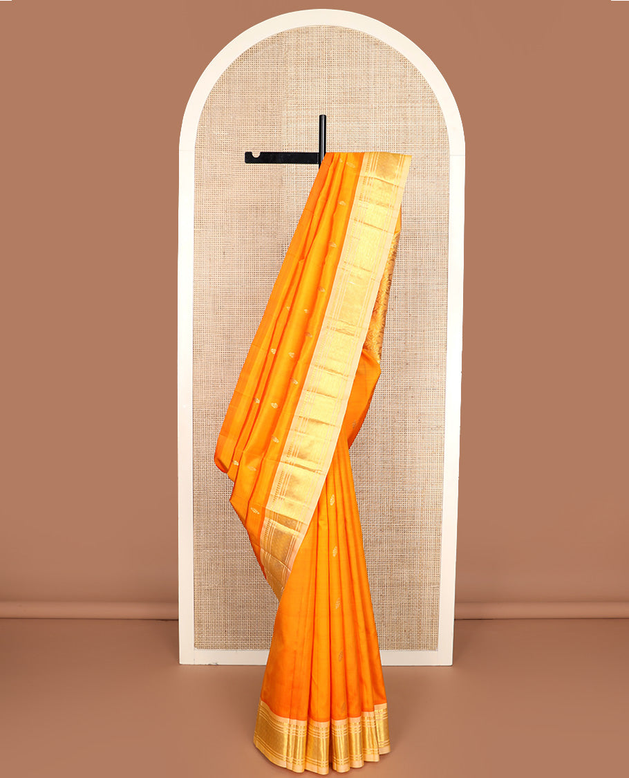 Orange zari buttas Kanchipuram silk saree, contrast one-sided border of paneer sombu, banaras, and jaal design, and zari design pallu