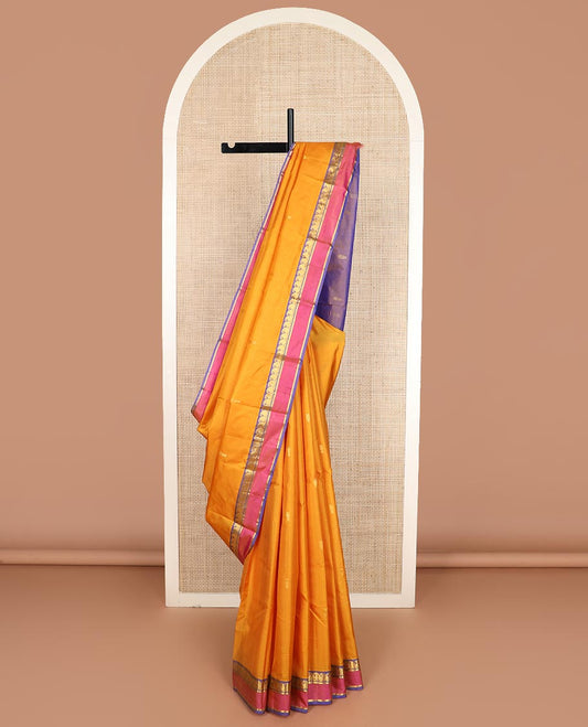 Yellow striped and buttas Kanchipuram silk saree, contrast rettai pettu border of vanki manga, and kathir designs, and zari design pallu
