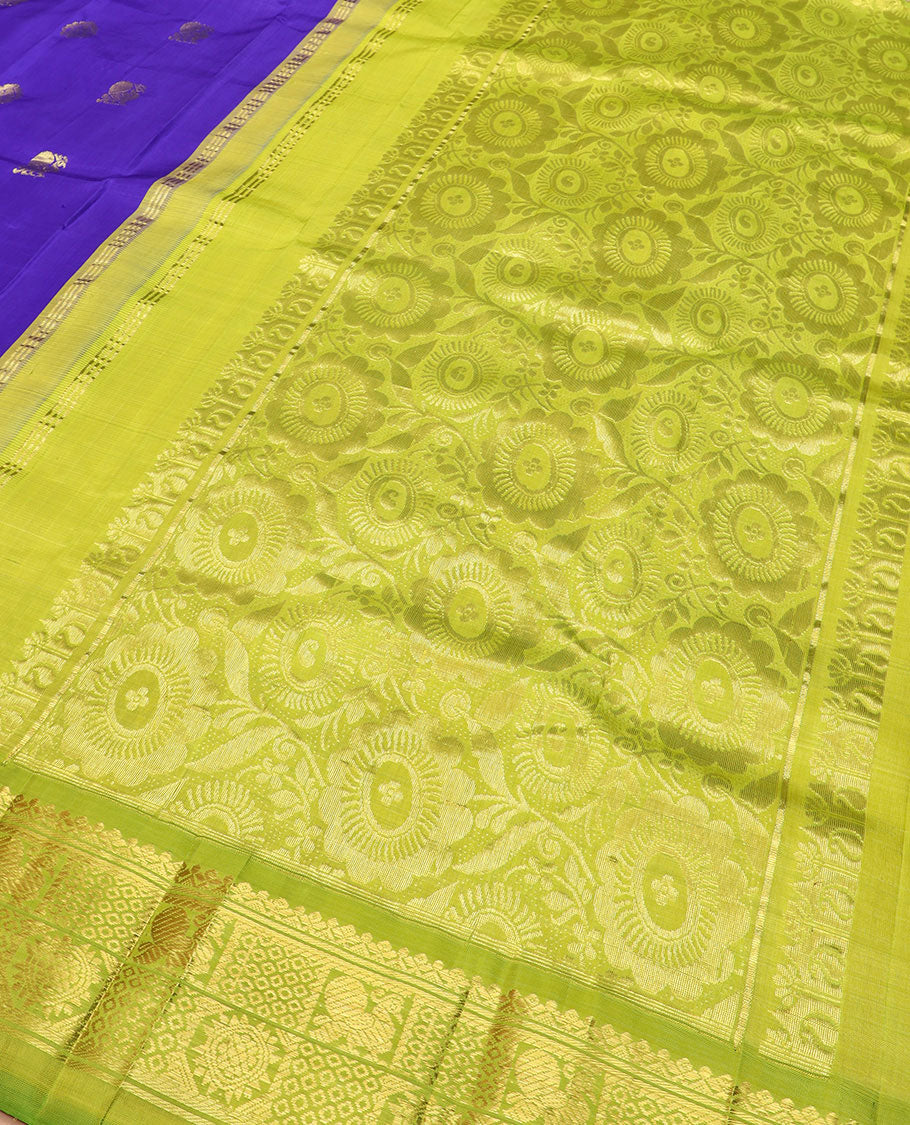 Blue zari buttas Kanchipuram silk saree, contrast thazampoo rekku checked border of mayil chakram designs, and floral design pallu