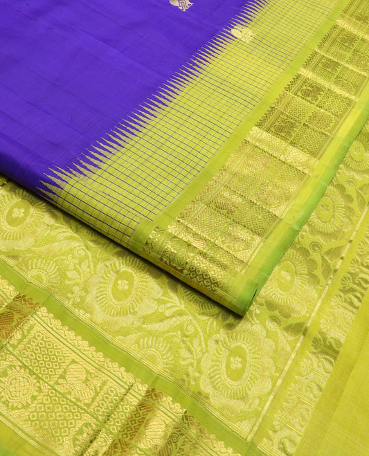 Blue zari buttas Kanchipuram silk saree, contrast thazampoo rekku checked border of mayil chakram designs, and floral design pallu
