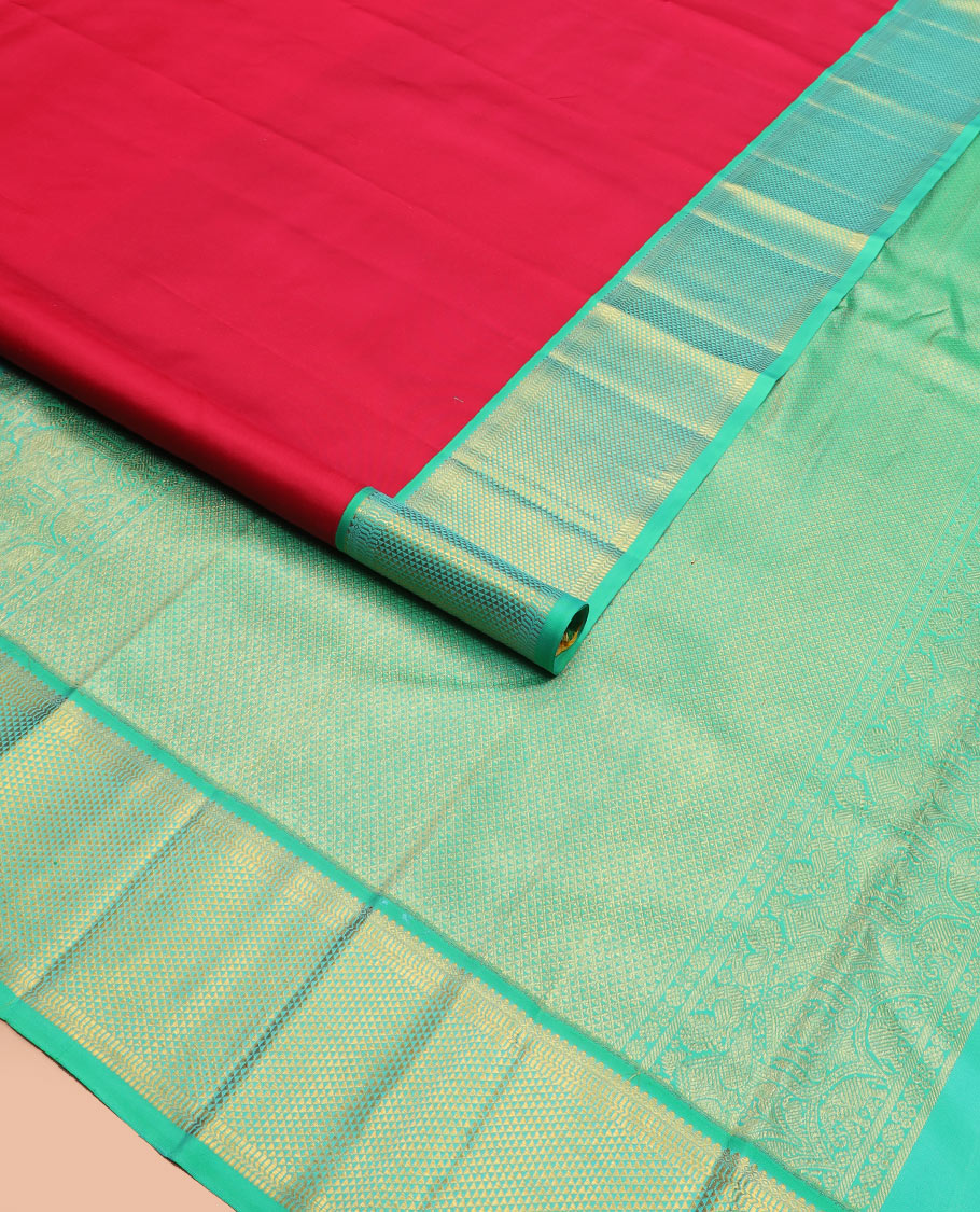 Red plain Kanchipuram silk saree, contrast border of thilakam mokku, muthu, banaras, and ara maadam designs, and ara maadam design pallu