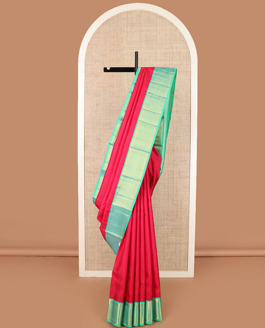 Red plain Kanchipuram silk saree, contrast border of thilakam mokku, muthu, banaras, and ara maadam designs, and ara maadam design pallu