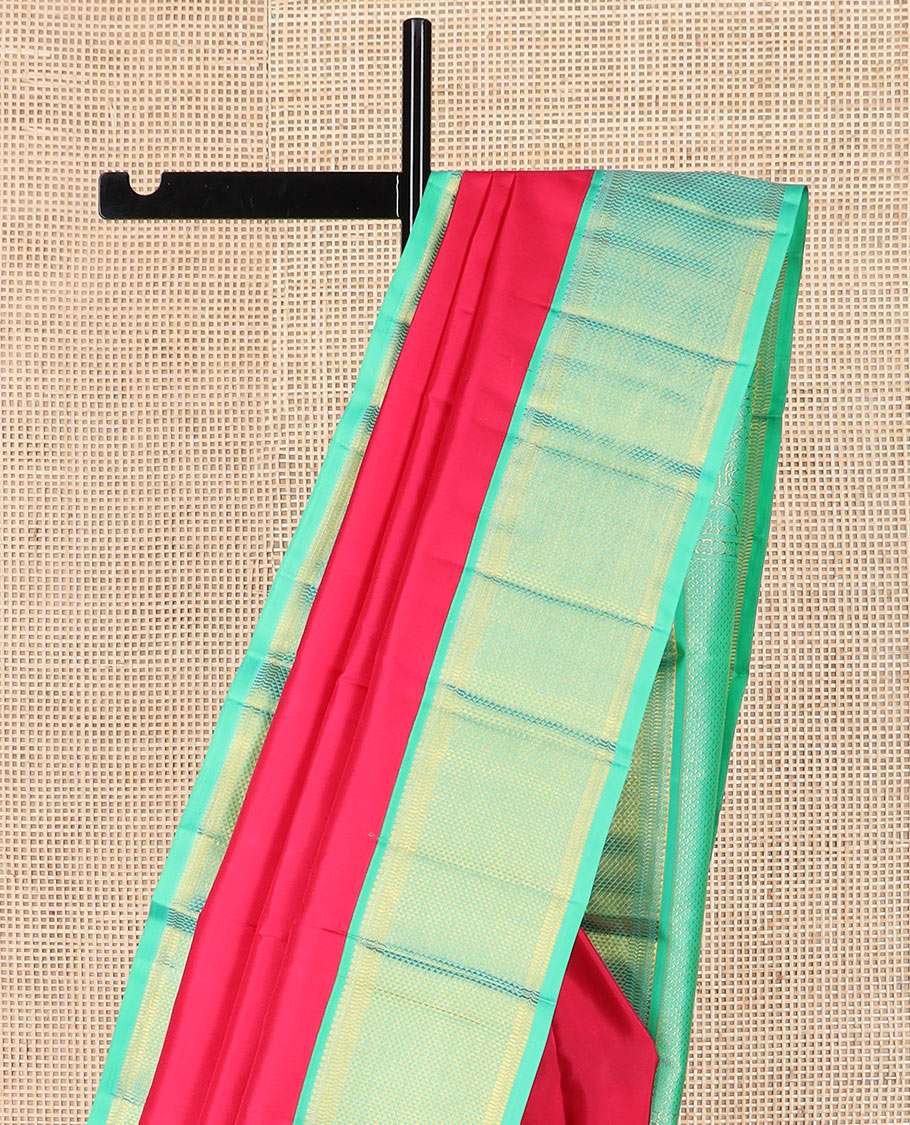 Red plain Kanchipuram silk saree, contrast border of thilakam mokku, muthu, banaras, and ara maadam designs, and ara maadam design pallu