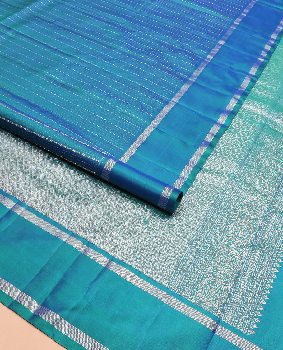 Blue zari striped Kanchipuram silk saree, contrast rettai pettu zari striped border, and jaal pallu