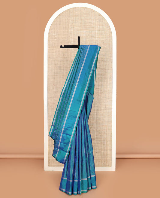 Blue zari striped Kanchipuram silk saree, contrast rettai pettu zari striped border, and jaal pallu