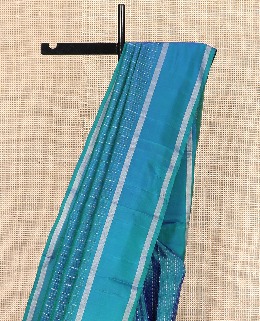 Blue zari striped Kanchipuram silk saree, contrast rettai pettu zari striped border, and jaal pallu