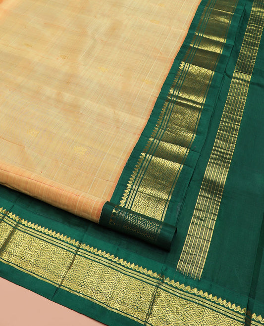 Orange Kanchipuram Silk Saree Sparsely Sparkled with Zari Buttas, Highlighted by Contrast One-Sided Korvai Border of Thilakam Mokku, Banaras, and Jaal Designs, Pallu Spotlighted with Zari Designs, and Comes Without a Blouse