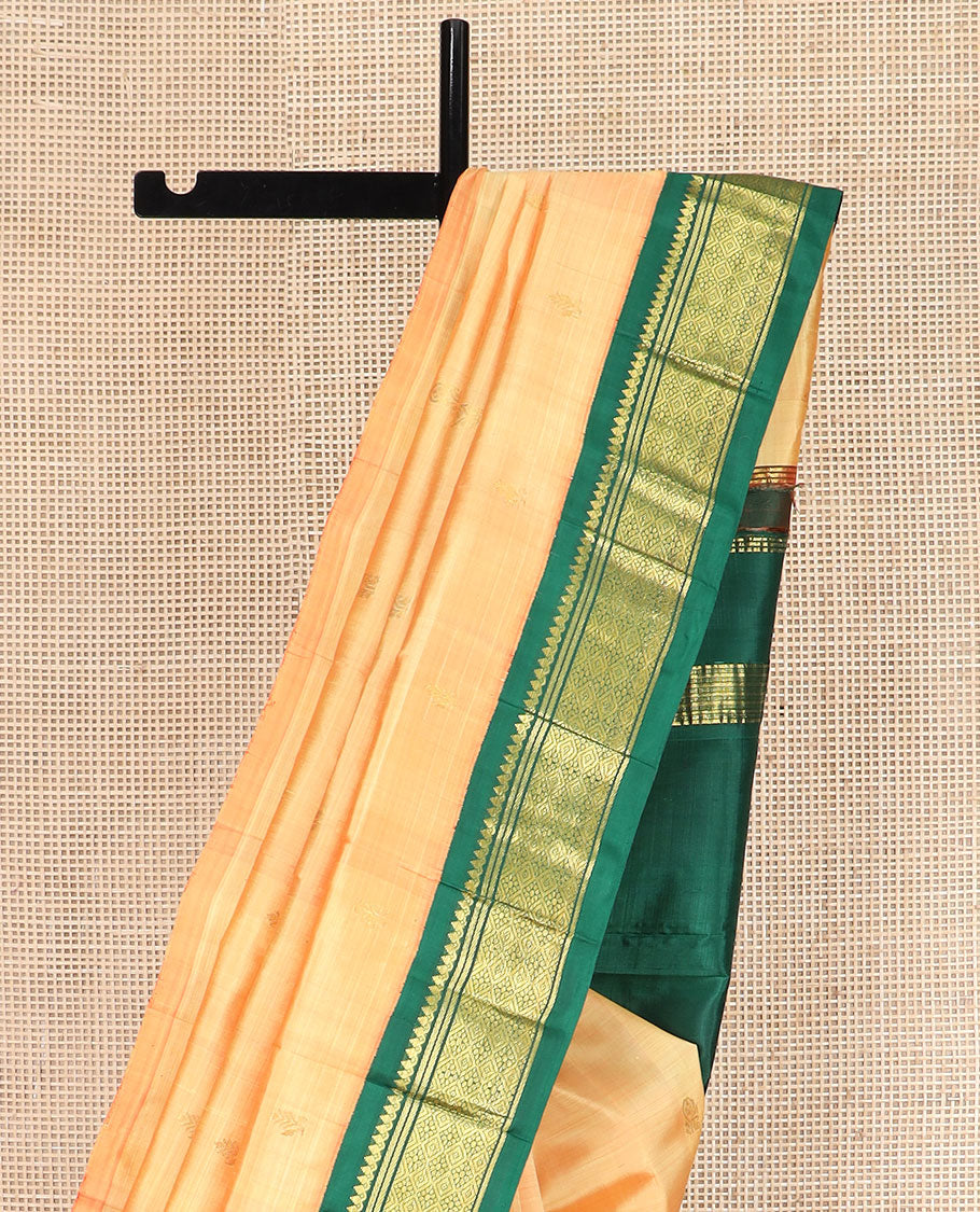 Orange Kanchipuram Silk Saree Sparsely Sparkled with Zari Buttas, Highlighted by Contrast One-Sided Korvai Border of Thilakam Mokku, Banaras, and Jaal Designs, Pallu Spotlighted with Zari Designs, and Comes Without a Blouse