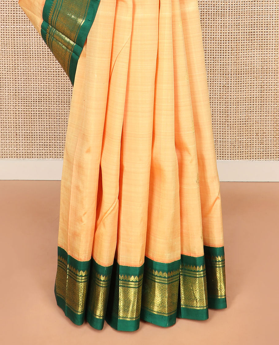 Orange Kanchipuram Silk Saree Sparsely Sparkled with Zari Buttas, Highlighted by Contrast One-Sided Korvai Border of Thilakam Mokku, Banaras, and Jaal Designs, Pallu Spotlighted with Zari Designs, and Comes Without a Blouse