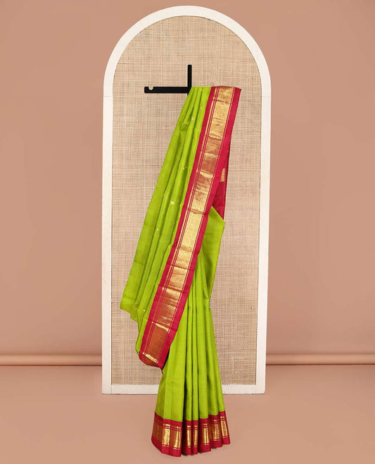 Green Kanchipuram Silk Saree, Beautified with Zari Buttas on Its Body, Complemented by a Contrast One-Sided Korvai Border of Banaras, and Jaal Designs, Pallu of Zari Designs, and Comes Without a Blouse