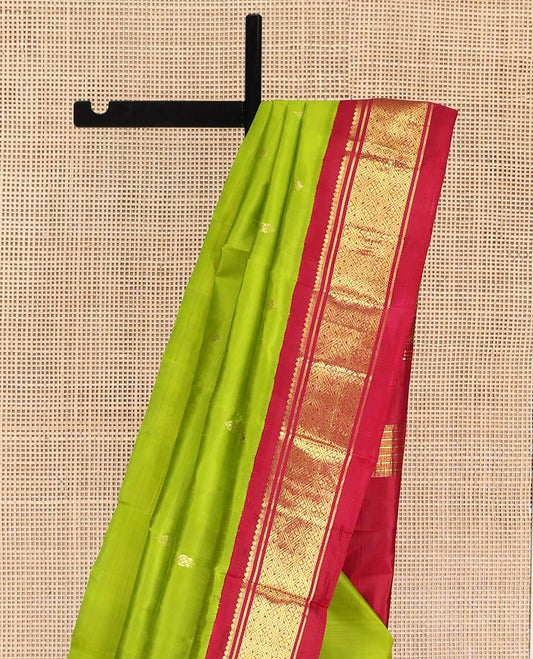 Green Kanchipuram Silk Saree, Beautified with Zari Buttas on Its Body, Complemented by a Contrast One-Sided Korvai Border of Banaras, and Jaal Designs, Pallu of Zari Designs, and Comes Without a Blouse