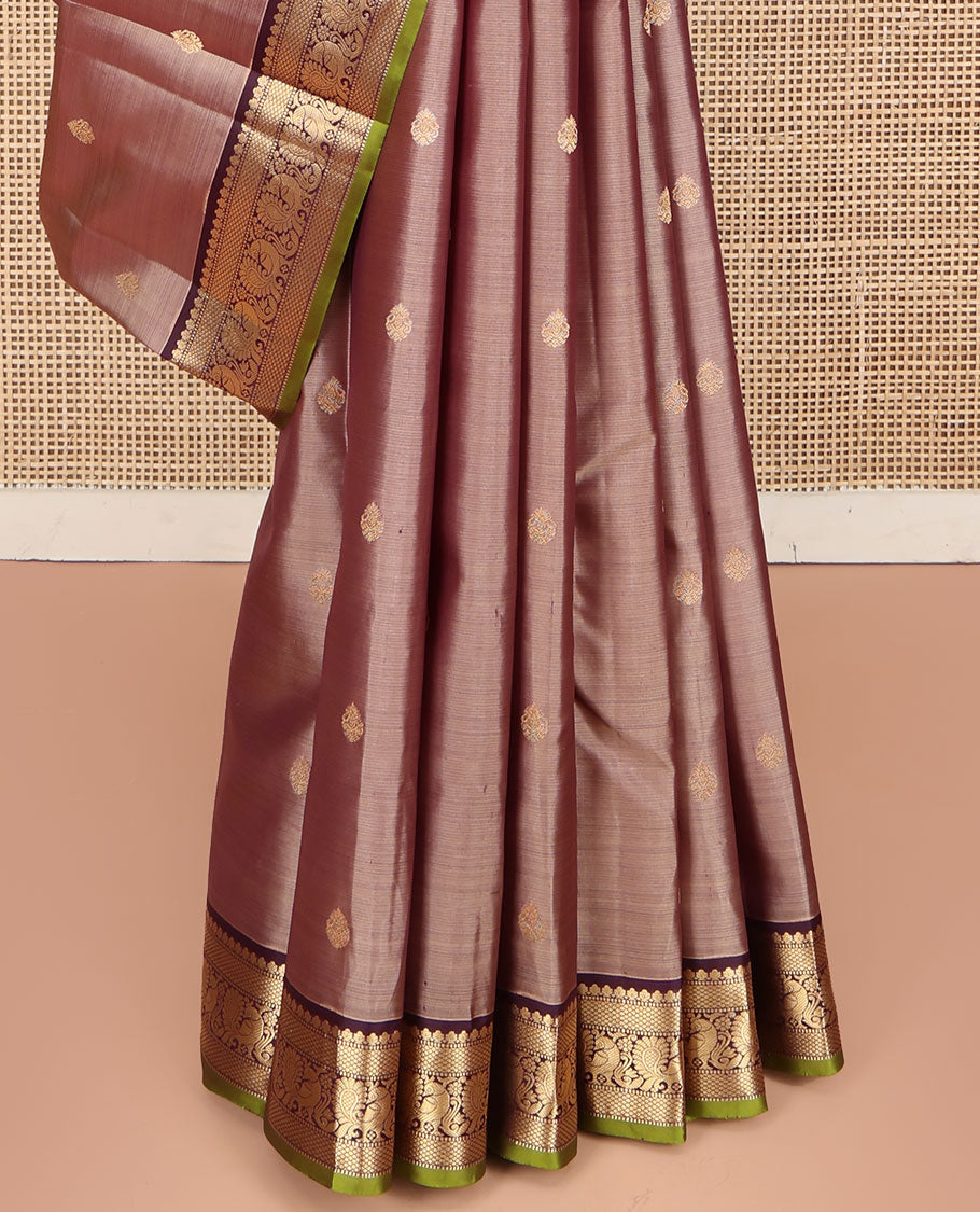 Rose Gold Pink Kanchipuram Silk Saree, Prettified with Zari Buttas All Over Its Body, Complemented by a Contrast Border of Mutthu, Mayil Kann, and Mayil Designs, Grandly Jaal Design Decked Up Pallu, and Paired with a Contrast Blouse
