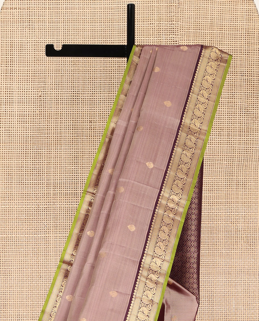 Rose Gold Pink Kanchipuram Silk Saree, Prettified with Zari Buttas All Over Its Body, Complemented by a Contrast Border of Mutthu, Mayil Kann, and Mayil Designs, Grandly Jaal Design Decked Up Pallu, and Paired with a Contrast Blouse
