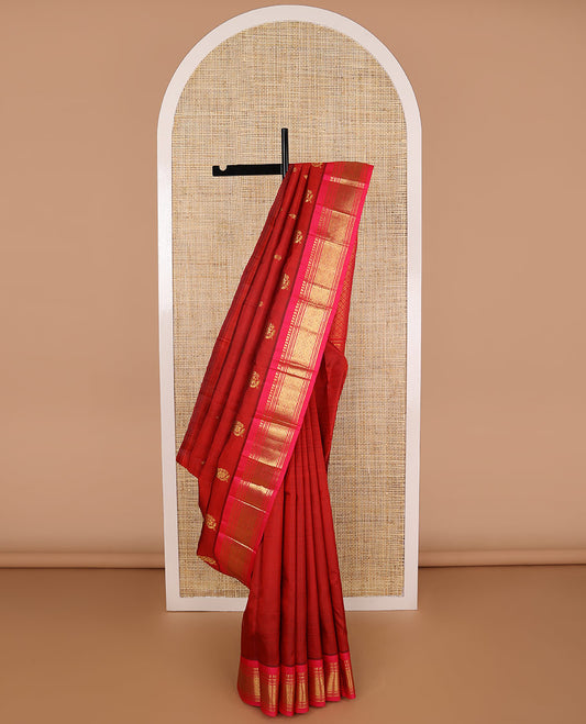 Red buttas kancheepuram silk saree with contrast border of thilakam mokku, banaras, muthu designs & zari design pallu
