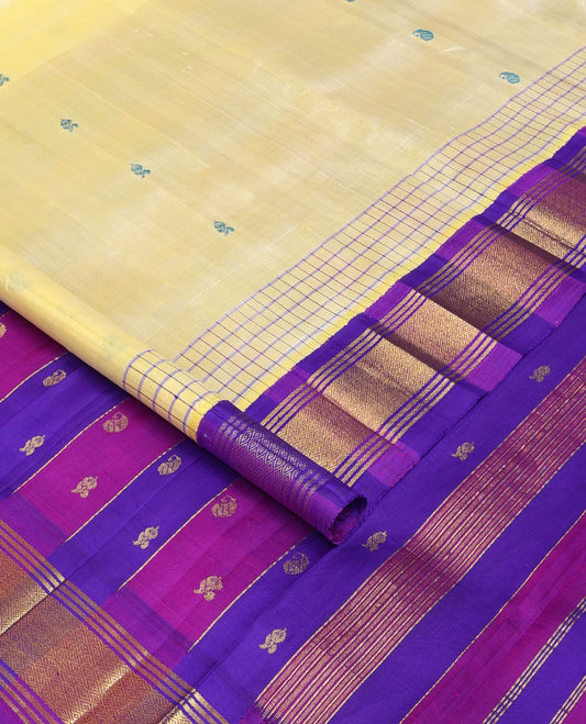 Pale yellow thread buttas Kanchipuram silk saree, contrast korvai one-sided border of banaras & mayil kann & zari design pallu
