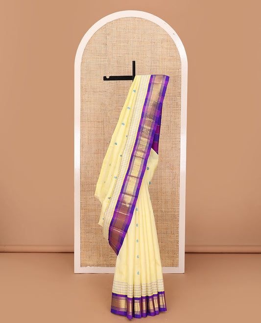Pale yellow thread buttas Kanchipuram silk saree, contrast korvai one-sided border of banaras & mayil kann & zari design pallu