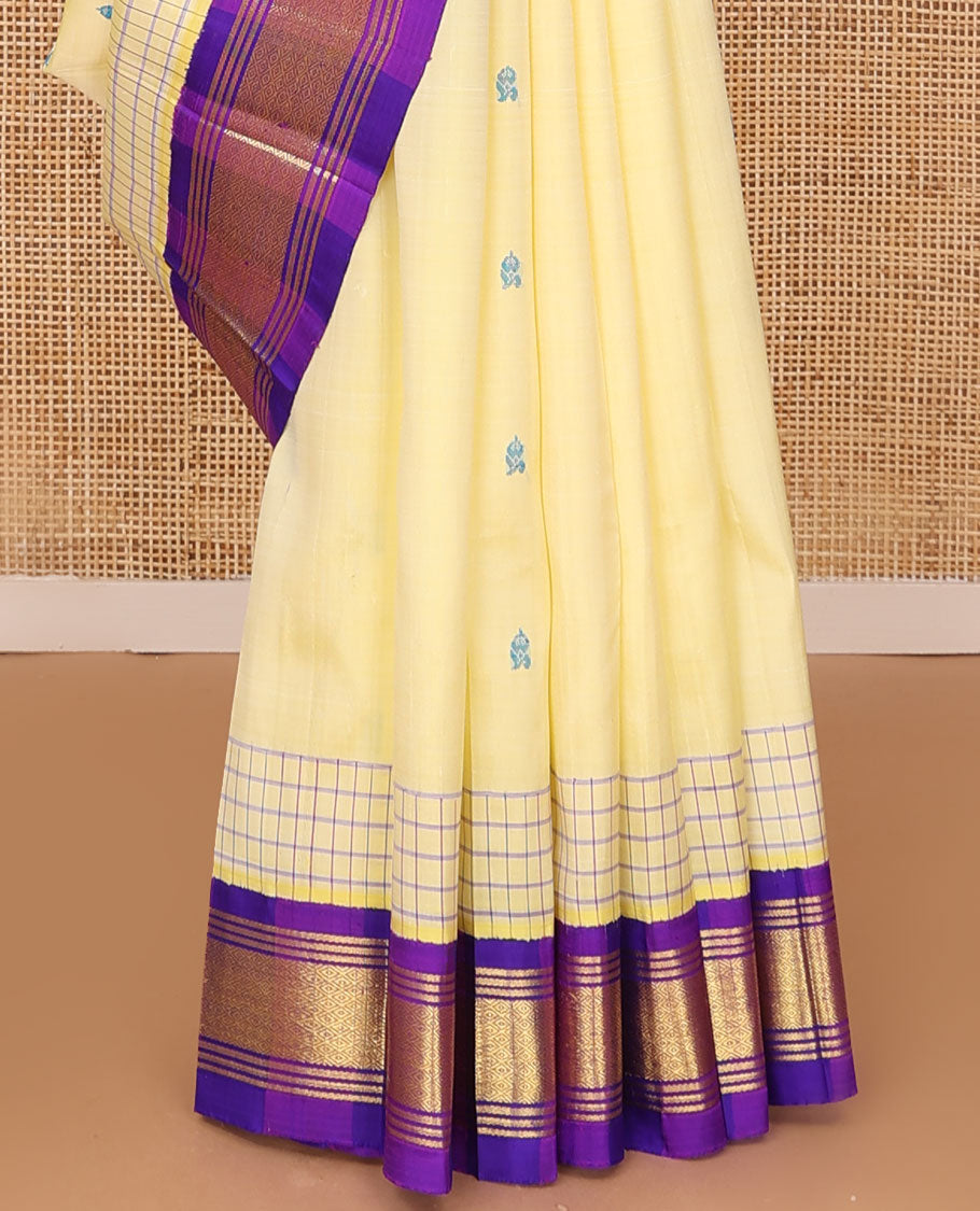 Pale yellow thread buttas Kanchipuram silk saree, contrast korvai one-sided border of banaras & mayil kann & zari design pallu