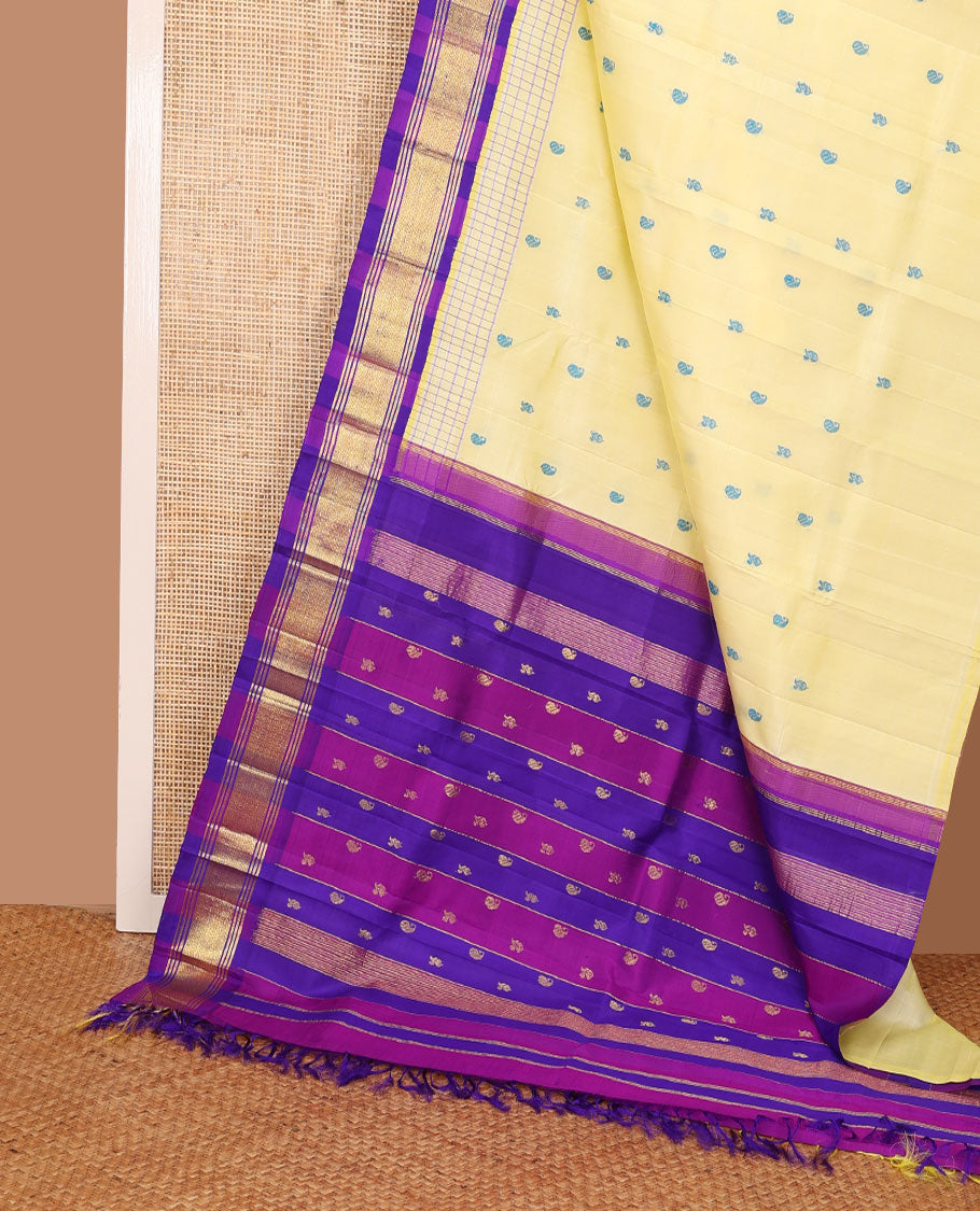 Pale yellow thread buttas Kanchipuram silk saree, contrast korvai one-sided border of banaras & mayil kann & zari design pallu
