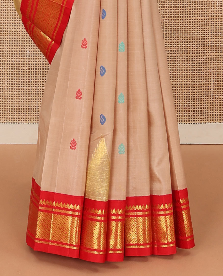 Sandal zari and thread buttas Kanchipuram silk saree, contrast one-sided korvai border of thikalam mokku, and jaal, and thazampoo rekku pallu