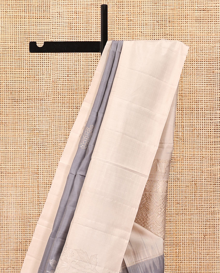 Grey Mayuri Soft Silk Saree, Elevated with Zari Buttas All Over Its Body, Complemented by Contrast Border, Intricately Designed Pallu, and Paired with a Contrast Blouse