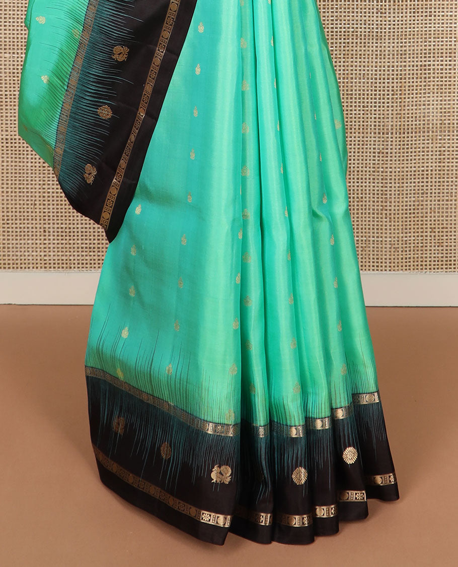 Turquoise zari buttas soft silk saree, contrast border of mayil chakram & kamalam designs & pallu of floral designs