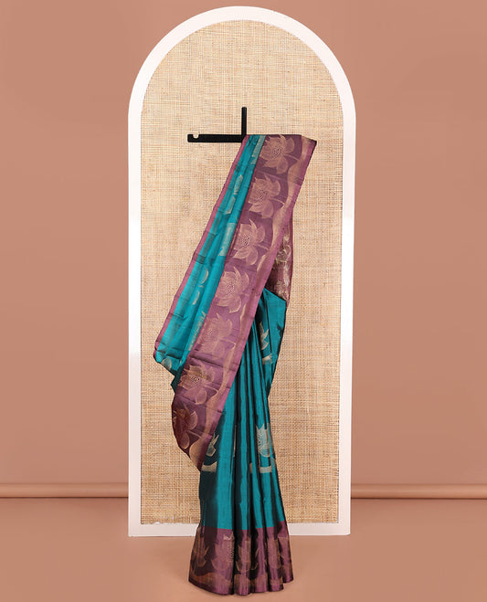 Blue Mayuri Soft Silk Saree, Graced with Floral Buttas, Complemented by Contrast Border of Floral Designs, Pallu of Geometric Designs, and Paired with Contrast Blouse