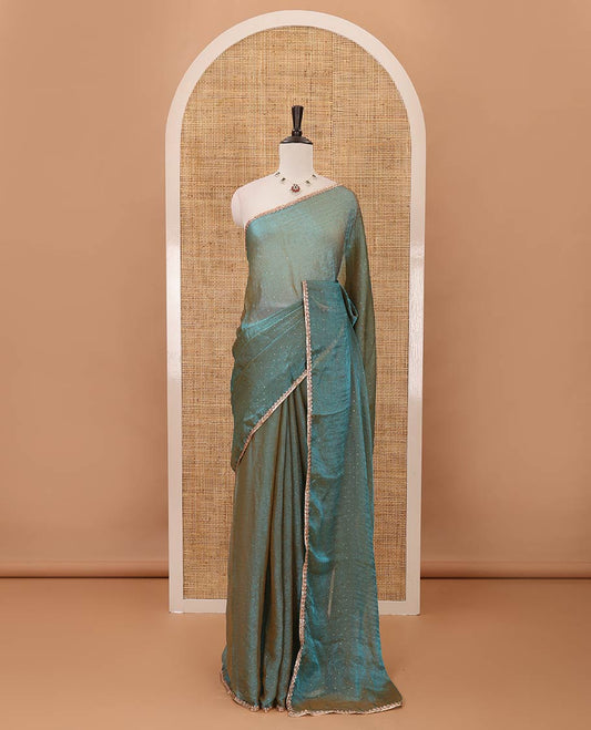 Peacock green Swarovski stone work embedded fendy-chiffon saree, scallop lace border & floral mixed embroidered blouse