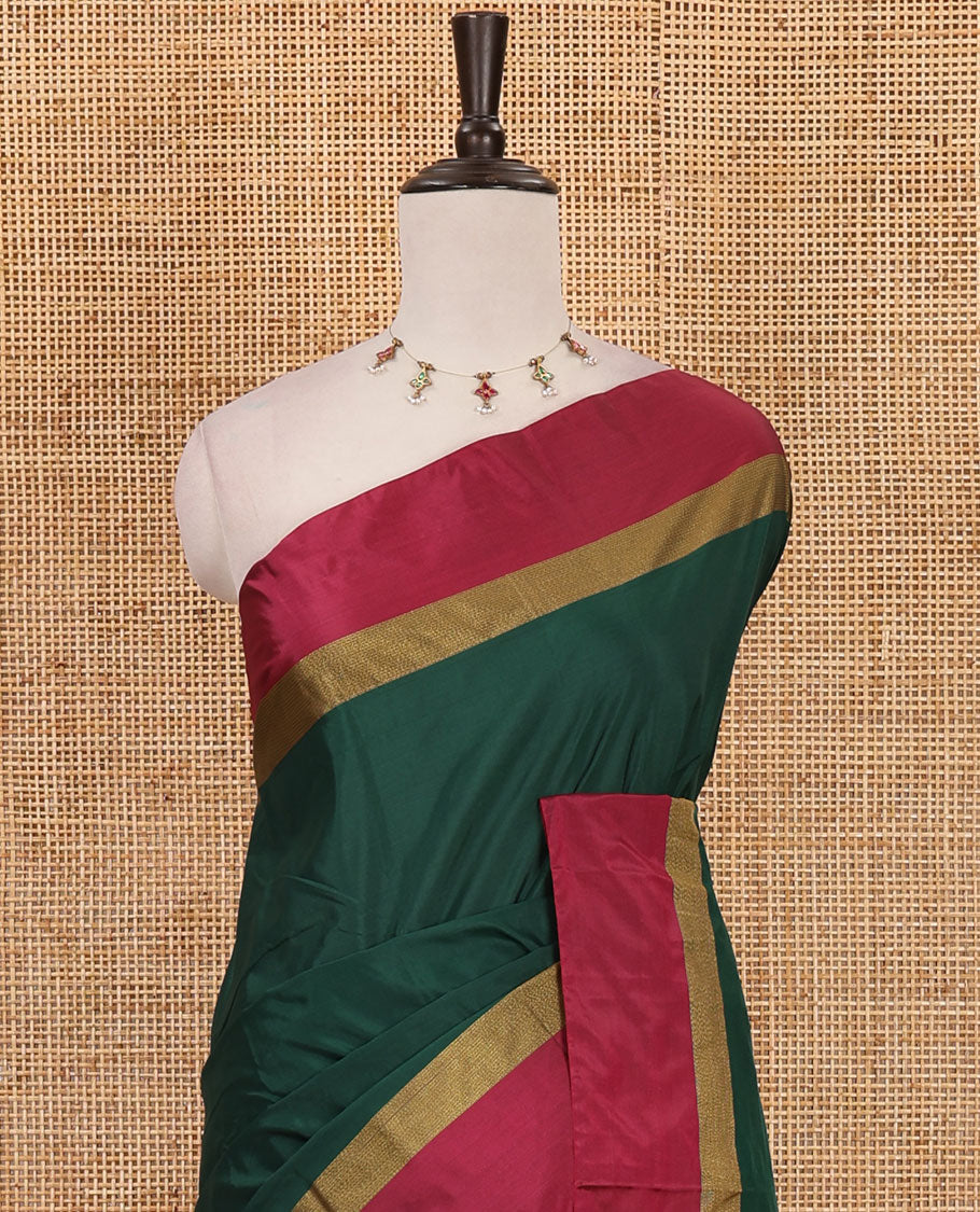 Bottle green full-plain semi-soft saree, contrast satin border of zari stripes, striped pallu & contrast plain blouse