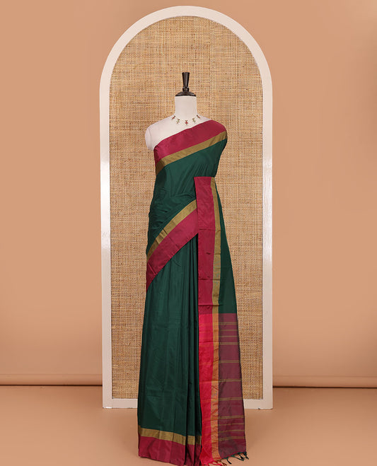 Bottle green full-plain semi-soft saree, contrast satin border of zari stripes, striped pallu & contrast plain blouse