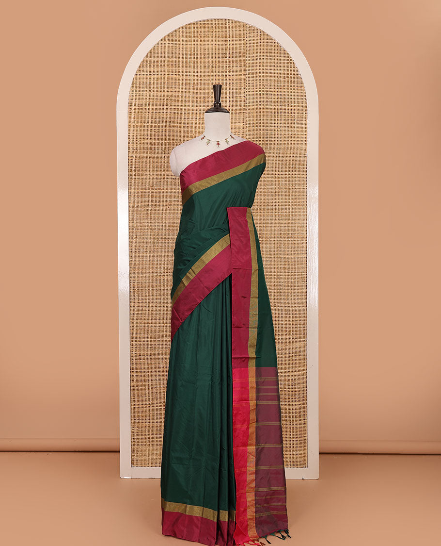 Bottle green full-plain semi-soft saree, contrast satin border of zari stripes, striped pallu & contrast plain blouse