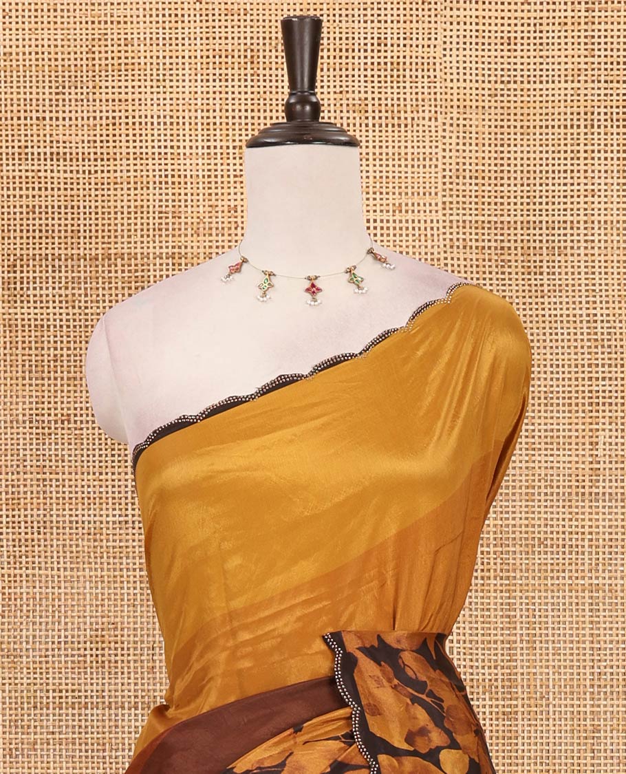 Brown ombre-colored floral printed silk crepe saree, swarovski stone work scallop border, printed pallu & printed blouse