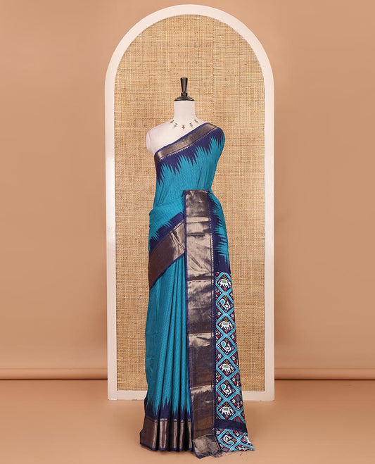 Blue striped dola-tussar saree, contrast temple zari border, patola animal motifs enclosed jaal printed pallu & patola printed blouse