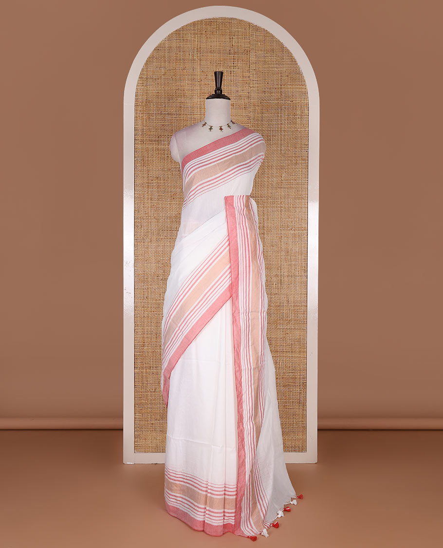 Cream-pink plain design mul mul cotton saree, contrast copper zari horizontally striped border, plain pallu, and plain blouse