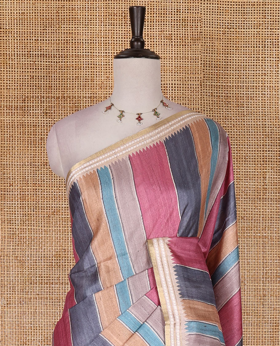 Multi color vertically striped semi-tussar saree, contrast resham thread border of temple and rudraksham motifs, striped pallu, and contrast striped printed blouse