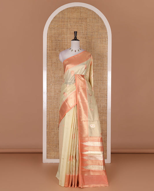 Sandal antique buttas tissue silk saree, contrast satin zari border of half-moon motifs, pallu of temple design pallu, and contrast butta blouse
