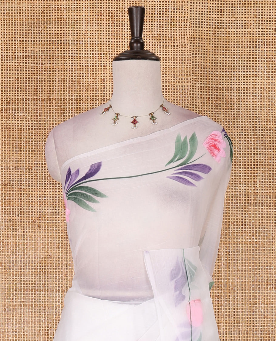 Borderless white floral motifs  hand brush painted semi-organza saree comes with tasseled pallu and without blouse