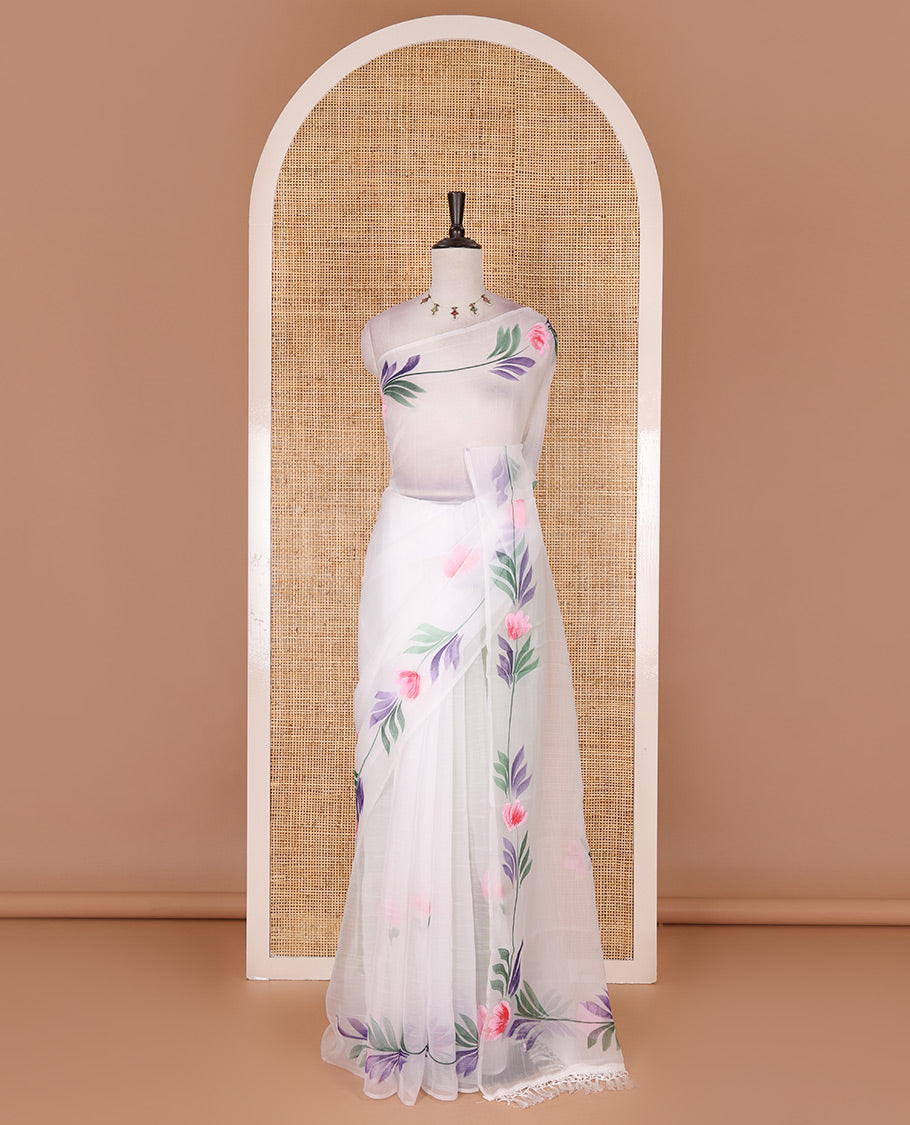 Borderless white floral motifs  hand brush painted semi-organza saree comes with tasseled pallu and without blouse